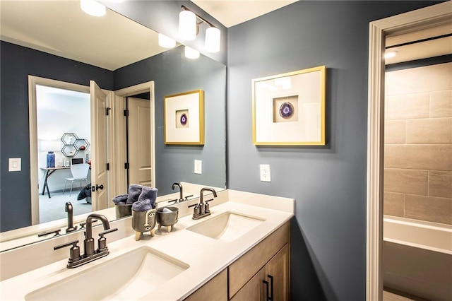 bathroom with a sink and double vanity