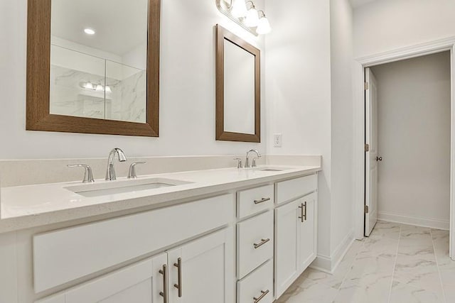 bathroom with vanity and a shower with shower door