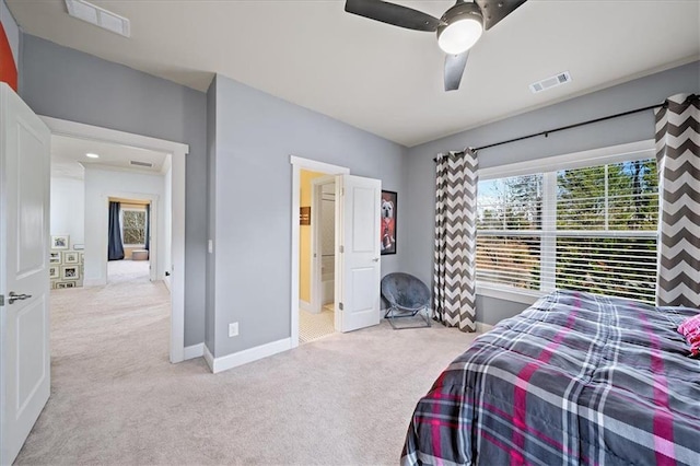 bedroom with ceiling fan and light carpet