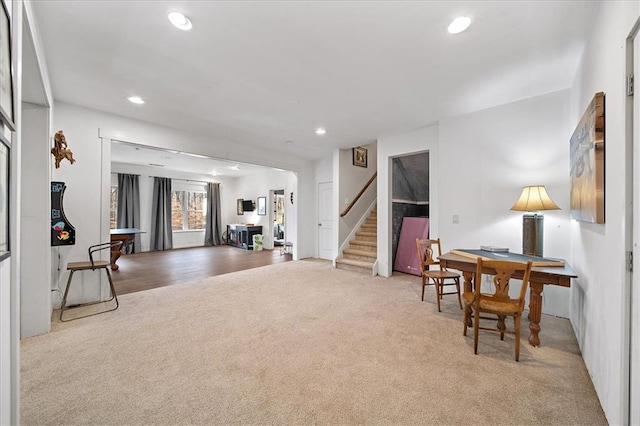 living area with light carpet