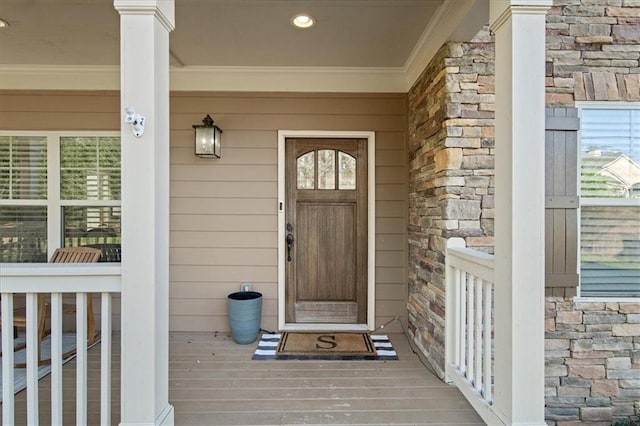 doorway to property featuring covered porch