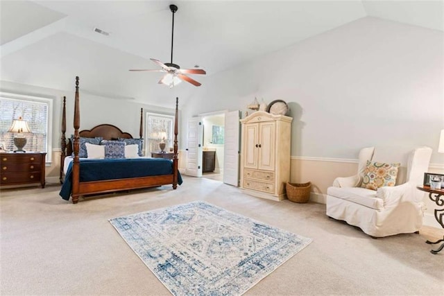 bedroom with lofted ceiling, a ceiling fan, visible vents, and light colored carpet