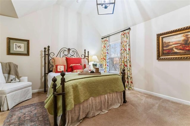 bedroom featuring light carpet, vaulted ceiling, and baseboards