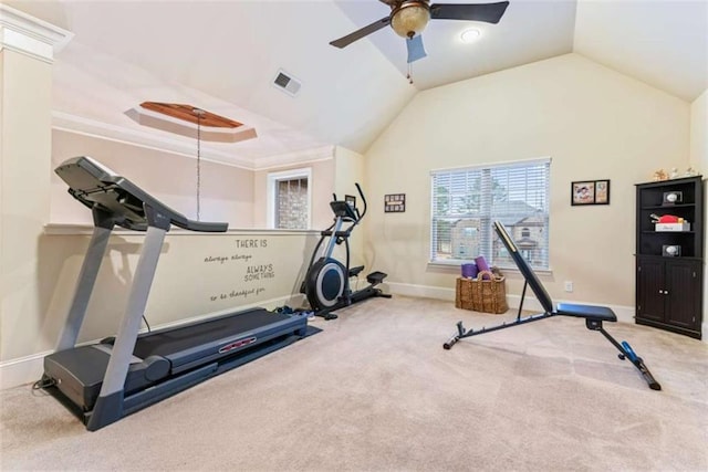 workout area with visible vents, carpet flooring, vaulted ceiling, ceiling fan, and baseboards