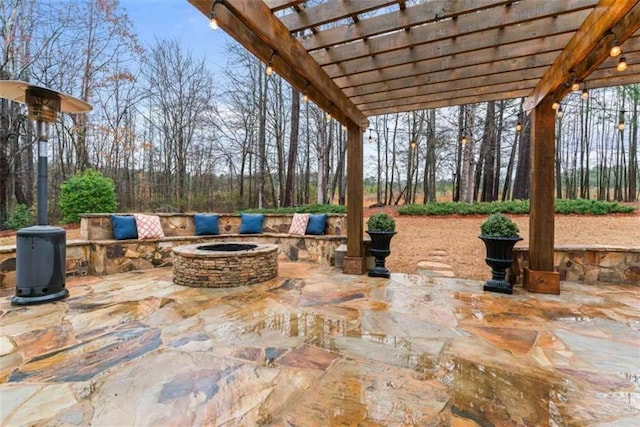 view of patio with an outdoor fire pit and a pergola