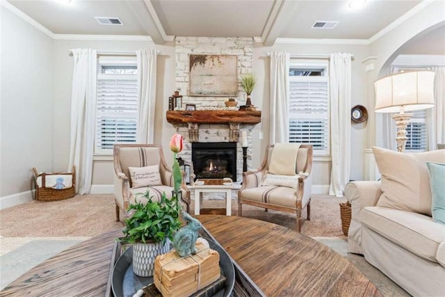 living area with carpet floors, beam ceiling, visible vents, and a fireplace