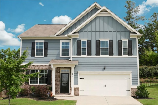 243 Hummingbird Trl, Dallas, GA 30132 - craftsman-style home with brick siding, board and batten siding, and driveway