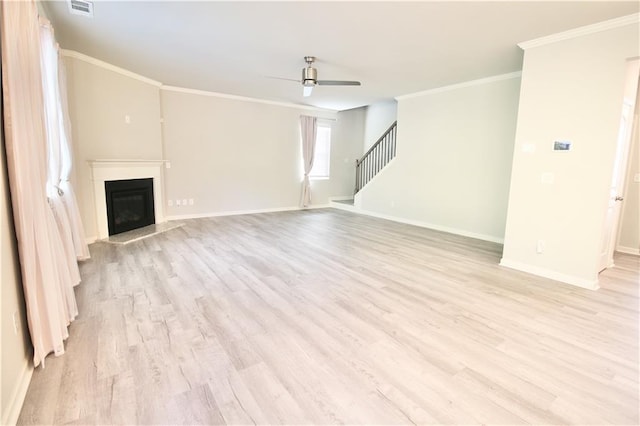 243 Hummingbird Trl, Dallas, GA 30132 - unfurnished living room featuring ceiling fan, light wood-type flooring, stairway, ornamental molding, and a fireplace