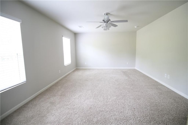243 Hummingbird Trl, Dallas, GA 30132 - spare room with a ceiling fan and light carpet