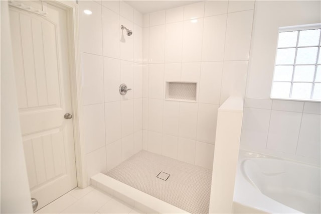 243 Hummingbird Trl, Dallas, GA 30132 - full bathroom featuring a bath, tiled shower, and tile patterned floors