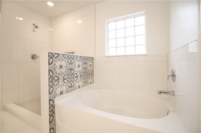 243 Hummingbird Trl, Dallas, GA 30132 - bathroom featuring a bath, a tile shower, and recessed lighting