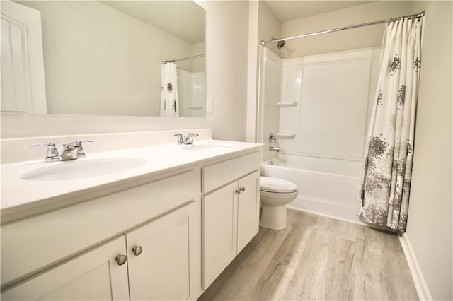243 Hummingbird Trl, Dallas, GA 30132 - bathroom with double vanity, wood finished floors, and shower / tub combo