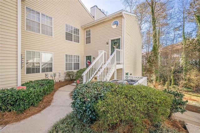 property entrance with a chimney