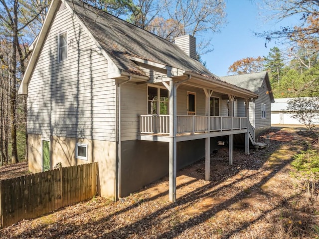 view of property exterior featuring covered porch