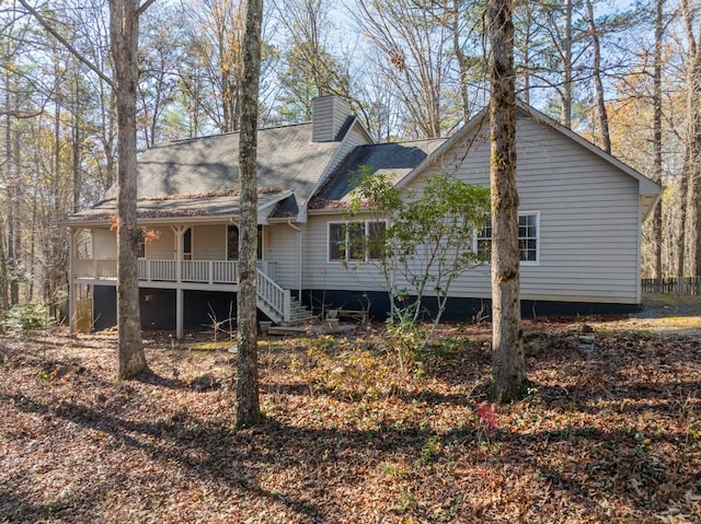 rear view of house with a porch