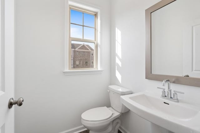 bathroom featuring toilet and sink