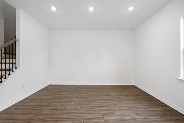 additional living space with dark hardwood / wood-style floors