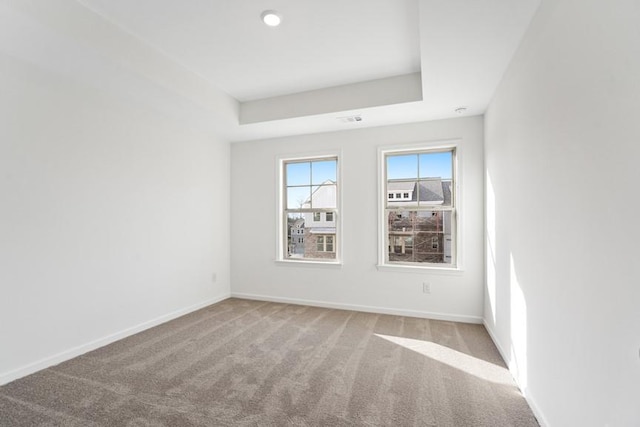 unfurnished room with light colored carpet