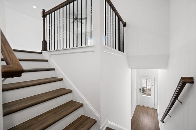 staircase with wood-type flooring