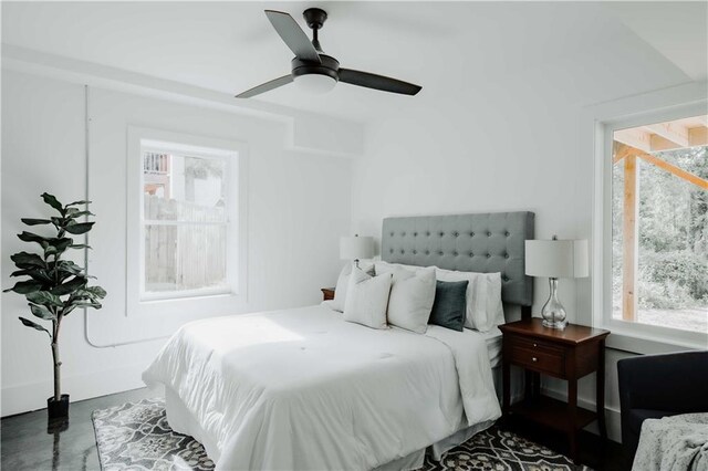 bedroom featuring a ceiling fan and concrete flooring
