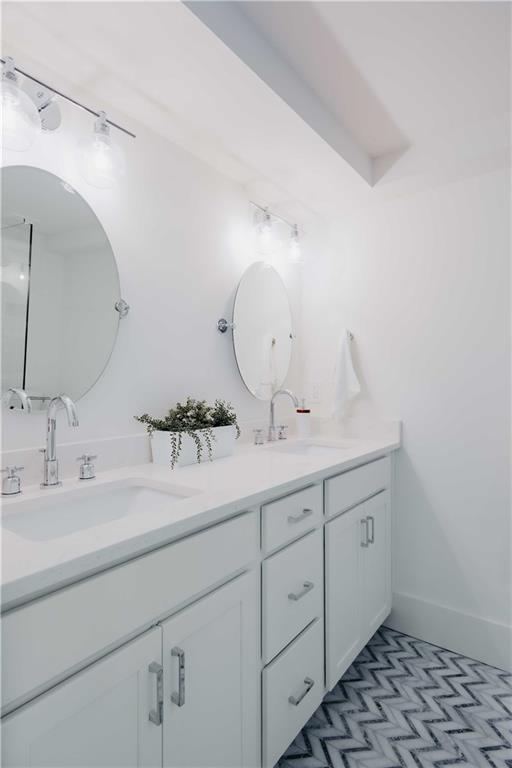 bathroom featuring double vanity