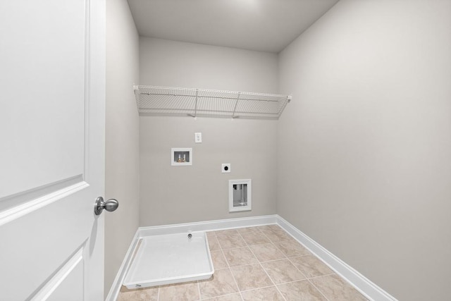 laundry area with hookup for an electric dryer, light tile patterned floors, and hookup for a washing machine