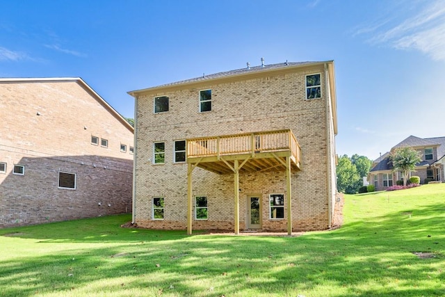 back of house with a lawn