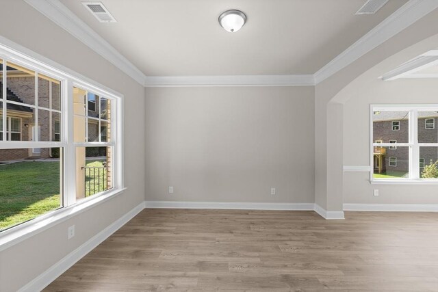 entryway featuring light hardwood / wood-style floors and ornamental molding