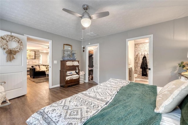 bedroom with ceiling fan, a walk in closet, and a closet