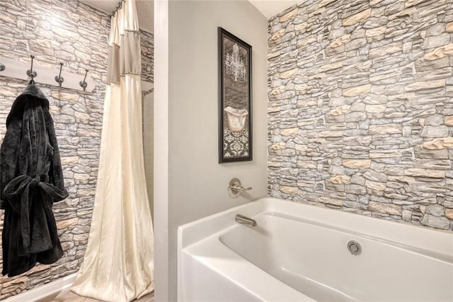 bathroom featuring a tub to relax in