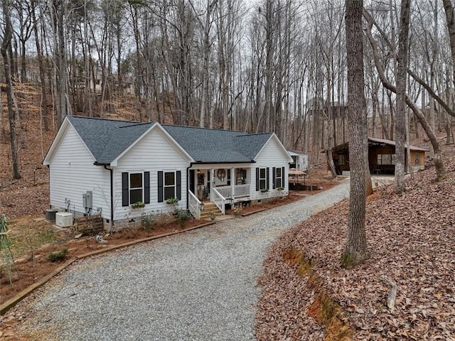 single story home with a carport and covered porch