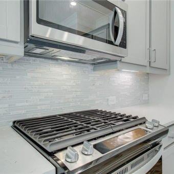 3352 Cranston Ln, Kennesaw, GA 30144 - kitchen view of stainless steel microwave and backsplash