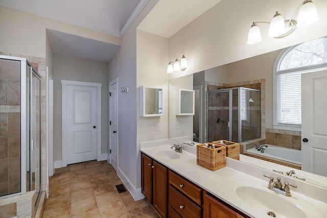 bathroom featuring double vanity, a shower stall, a sink, and a bath