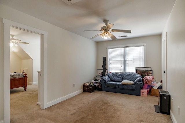 living area featuring a ceiling fan, carpet, visible vents, and baseboards