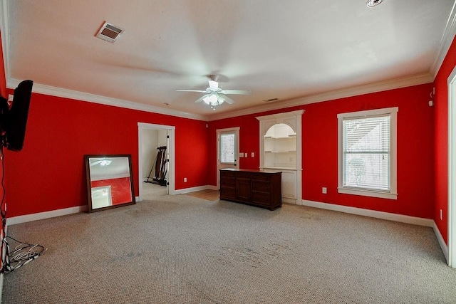 unfurnished bedroom with visible vents, crown molding, and baseboards