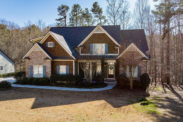 craftsman-style home with brick siding