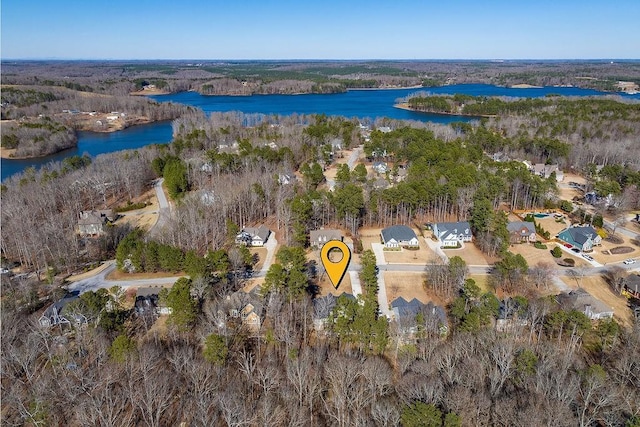 aerial view featuring a water view and a wooded view