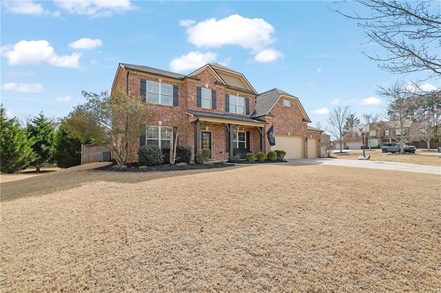 view of front facade featuring a porch, brick siding, driveway, and an attached garage