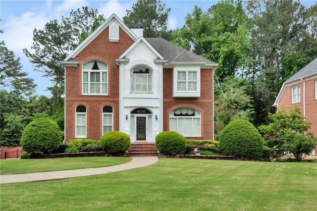 470 Manor Oak Ln SE, Marietta, GA 30067 - view of front of home featuring a front lawn, brick siding, and a chimney