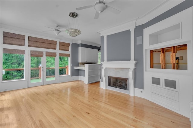 470 Manor Oak Ln SE, Marietta, GA 30067 - unfurnished living room featuring ceiling fan, ornamental molding, a fireplace, and light wood-style flooring