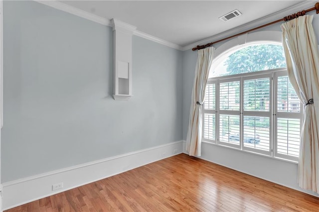 470 Manor Oak Ln SE, Marietta, GA 30067 - spare room featuring healthy amount of natural light, light wood-style floors, and crown molding