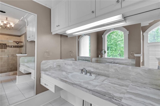 470 Manor Oak Ln SE, Marietta, GA 30067 - full bathroom featuring tile patterned floors, a tile shower, ornamental molding, vanity, and a chandelier