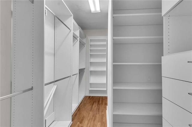 470 Manor Oak Ln SE, Marietta, GA 30067 - walk in closet featuring wood finished floors