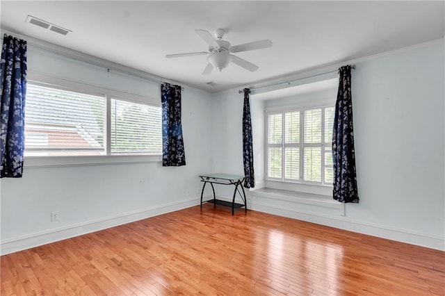 470 Manor Oak Ln SE, Marietta, GA 30067 - spare room featuring healthy amount of natural light, wood finished floors, crown molding, baseboards, and ceiling fan