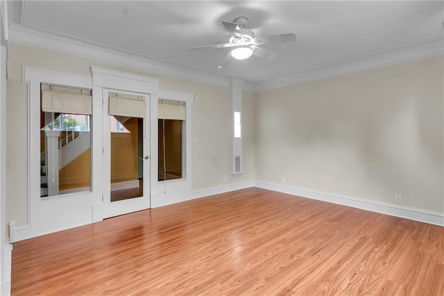 470 Manor Oak Ln SE, Marietta, GA 30067 - empty room featuring ceiling fan, ornamental molding, wood finished floors, baseboards, and french doors