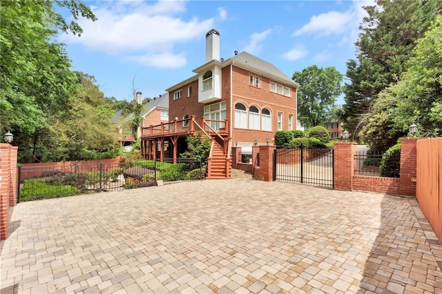 470 Manor Oak Ln SE, Marietta, GA 30067 - view of front of property featuring stairs, brick siding, a chimney, and a gate