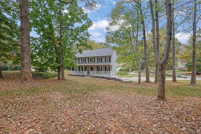 colonial-style house with covered porch