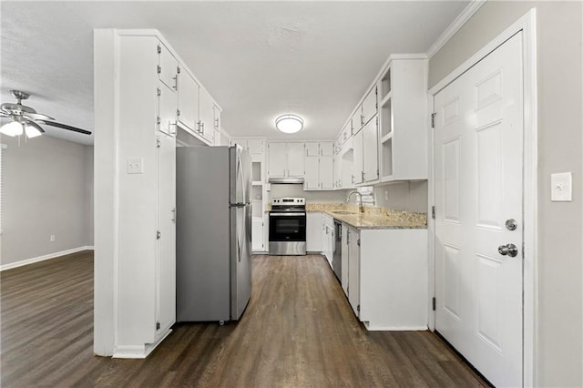 kitchen featuring appliances with stainless steel finishes, ceiling fan, dark hardwood / wood-style flooring, white cabinets, and sink