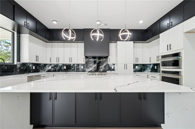 155 Westbrook St, Buford, GA 30518 - kitchen featuring light stone counters, a spacious island, and decorative backsplash