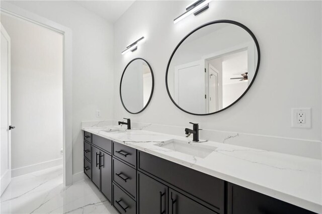 155 Westbrook St, Buford, GA 30518 - bathroom featuring baseboards, double vanity, marble finish floor, and a sink